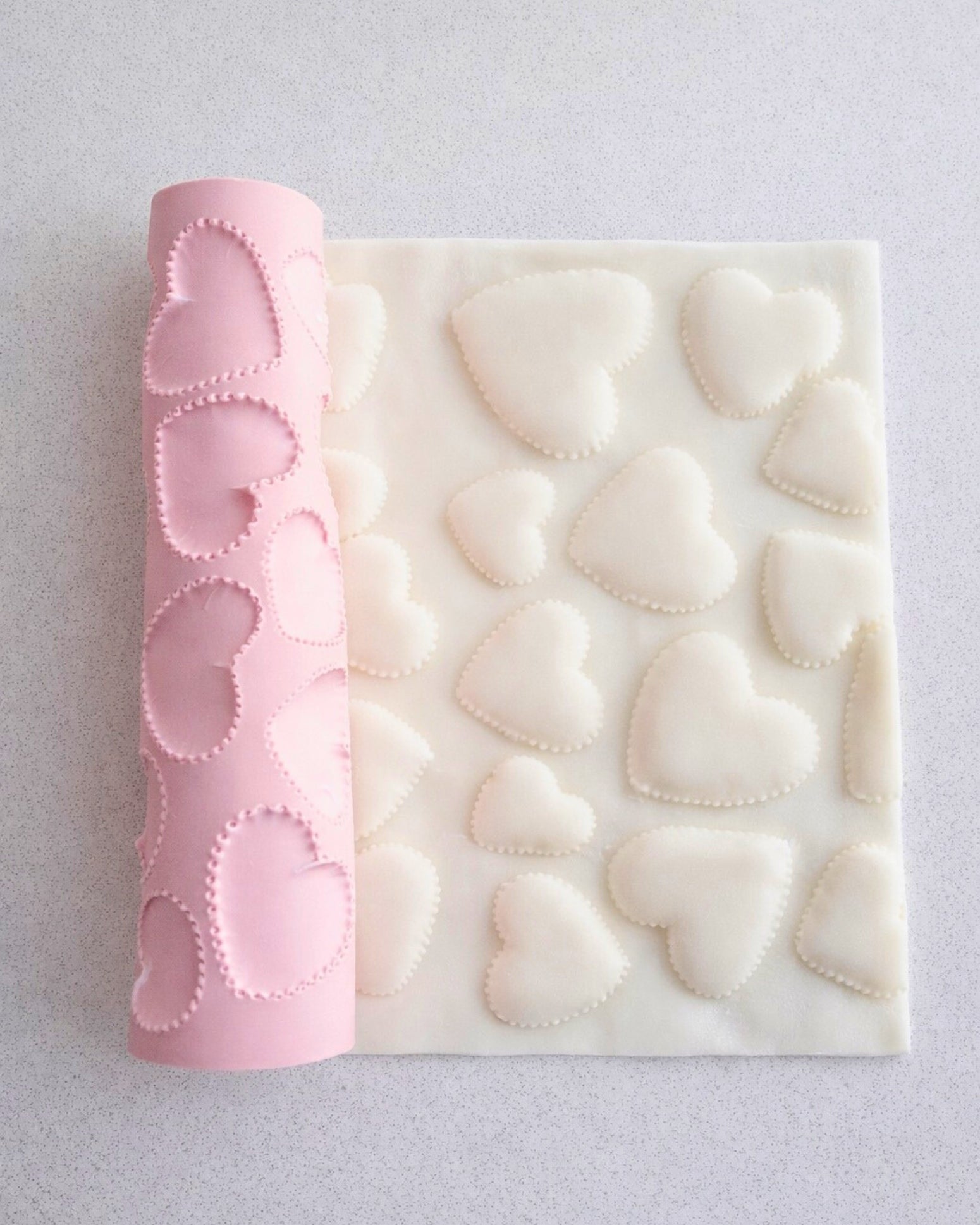 Hearts texture rolling pin by ML Bespoke Cakes creating stitched heart pattern on fondant