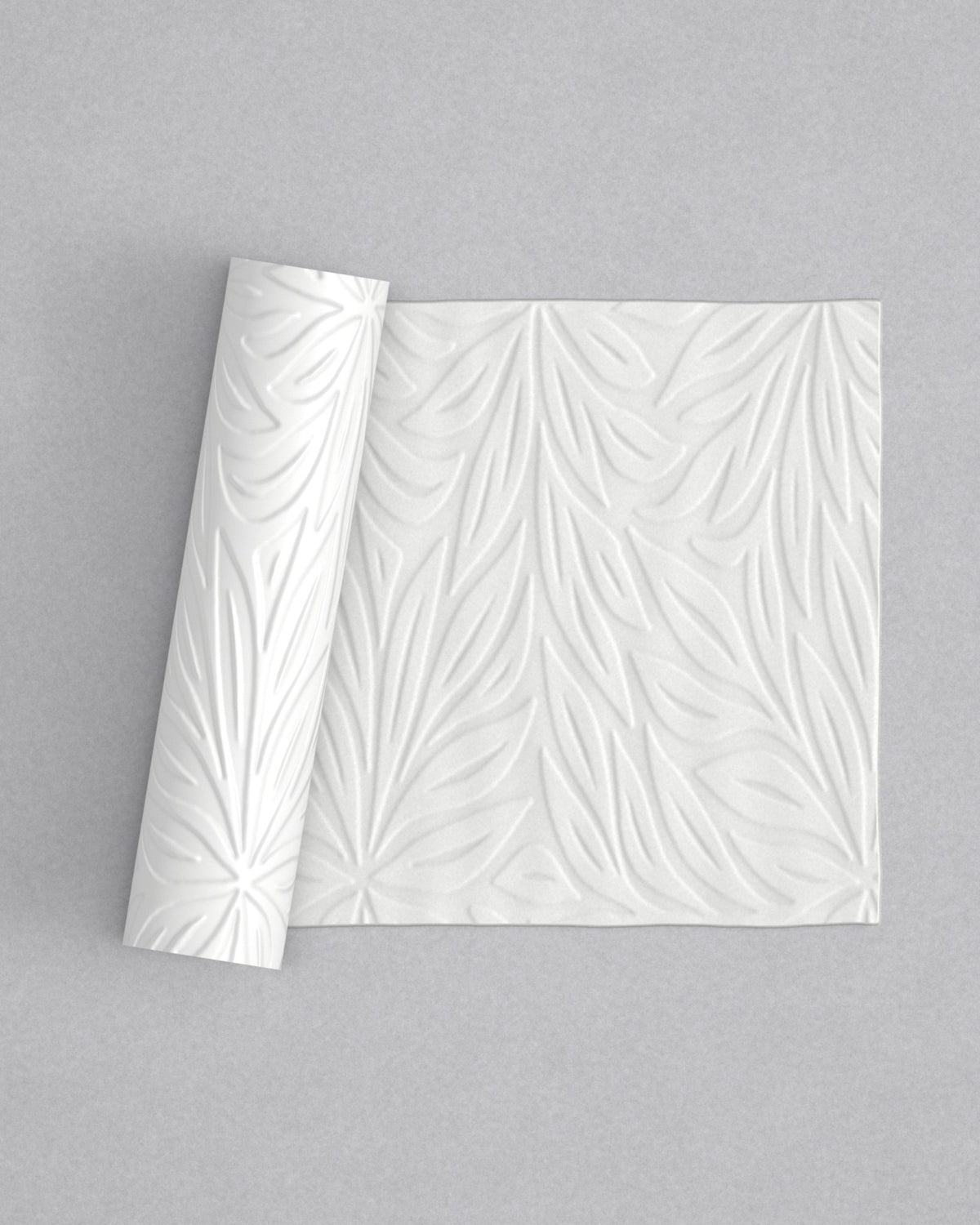 No.20 Full Bloom mini 4" texture rolling pin with its pattern rolled out on white fondant - Prop Options