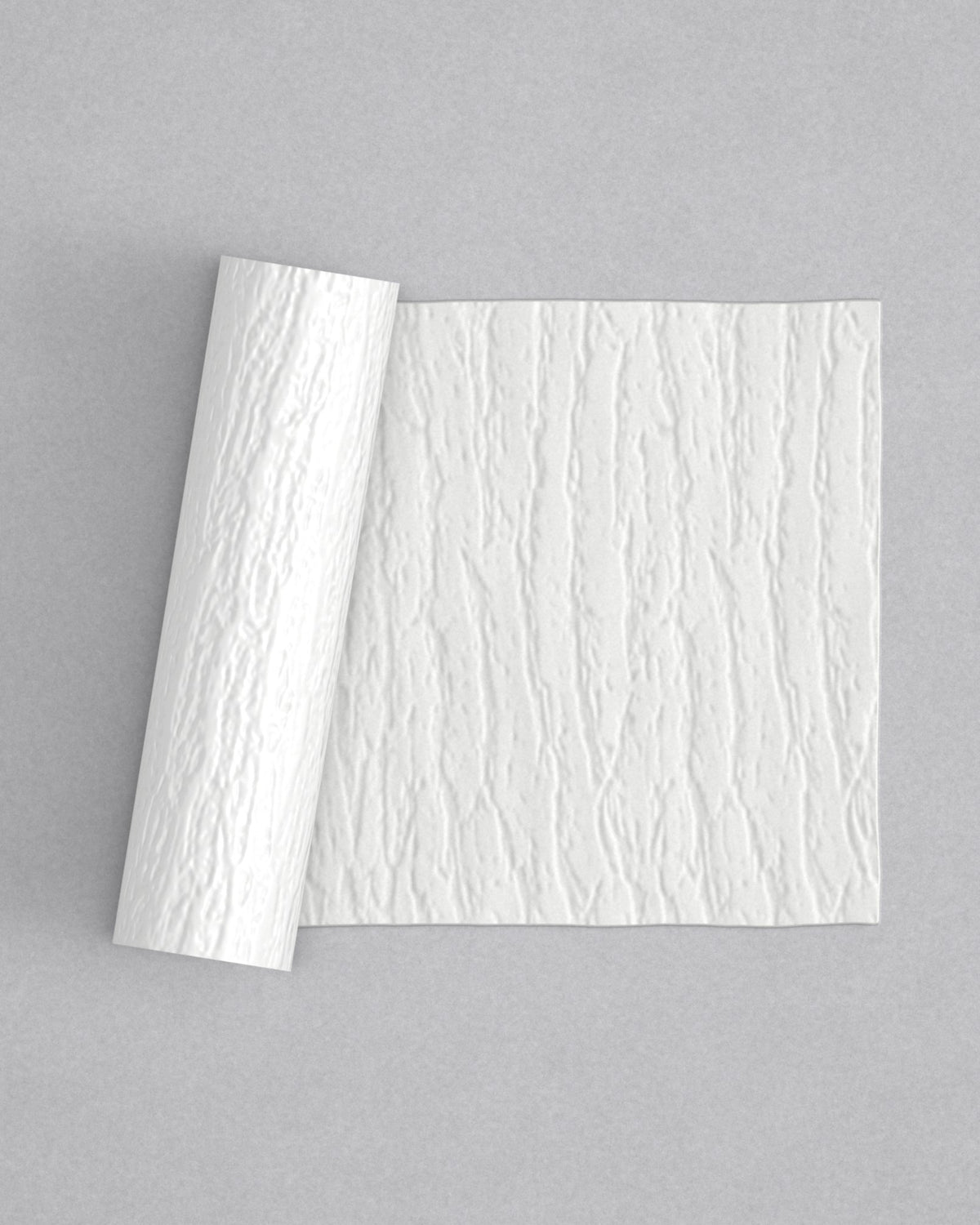 No.24 Bark mini 4" texture rolling pin with its pattern rolled out on white fondant - Prop Options