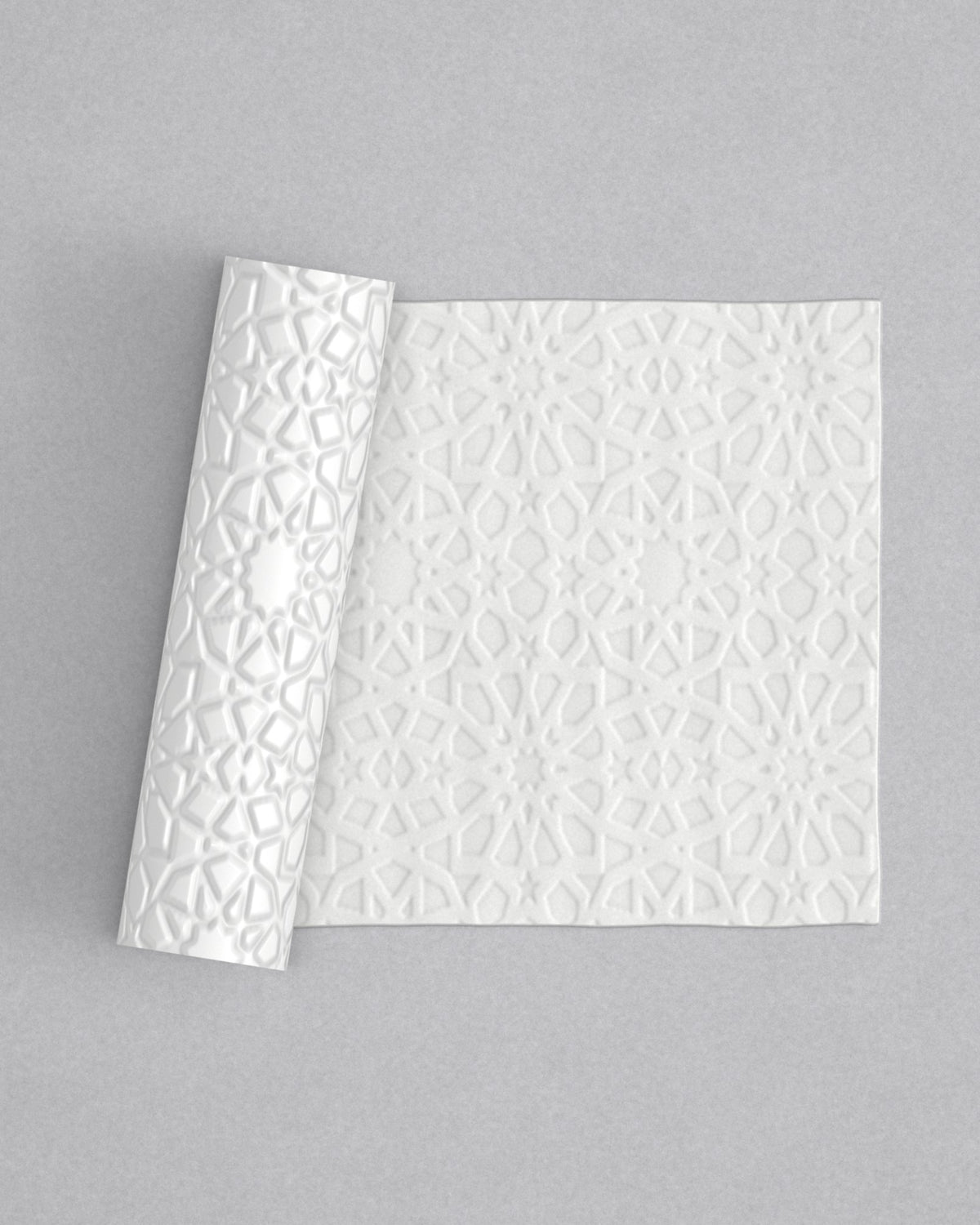 No.47 Nurrah mini 4" texture rolling pin with its pattern rolled out on white fondant - Prop Options
