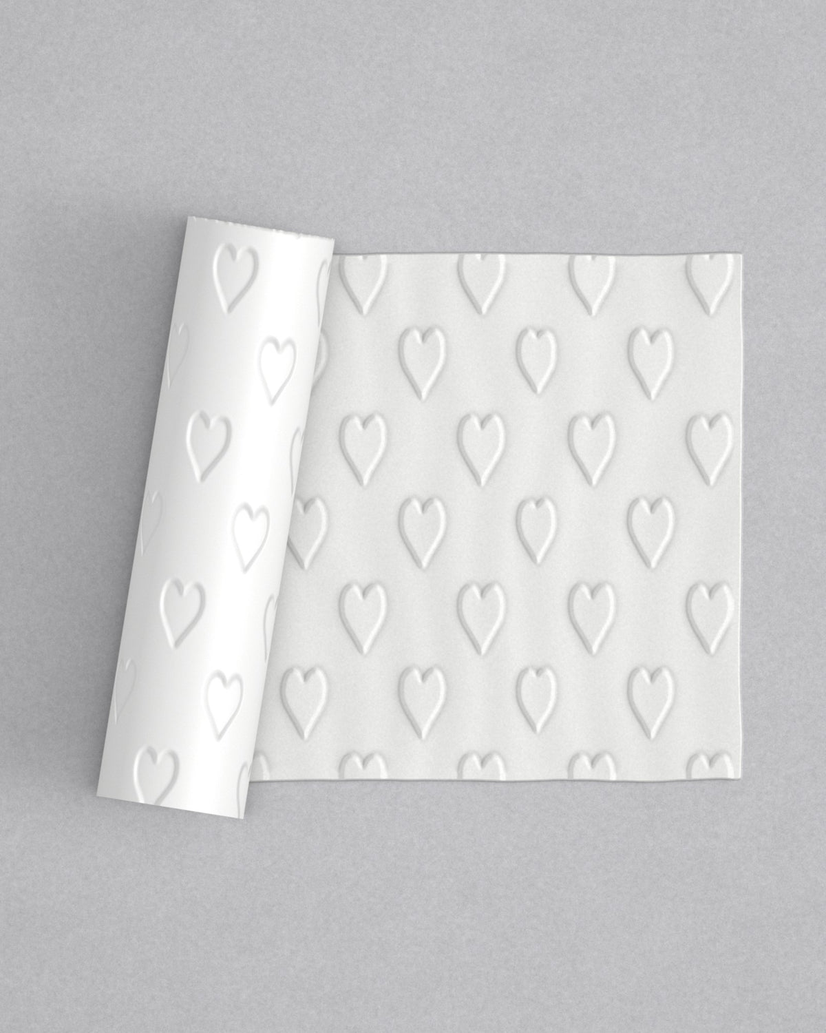 No.73 Hearts mini 4" texture rolling pin with its pattern rolled out on white fondant - Prop Options