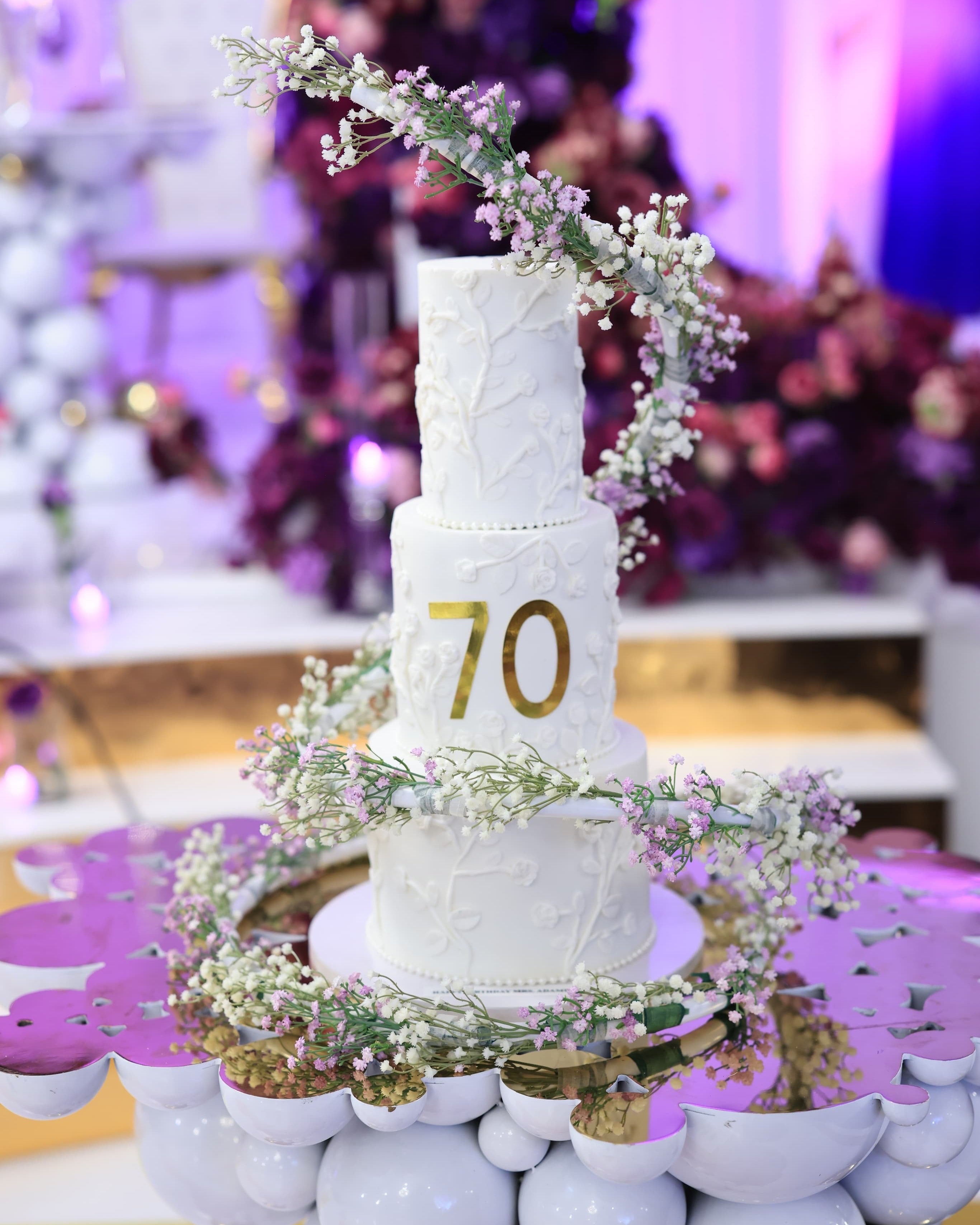 Cake Spiral - Metal Wrap in use on a tall tiered cake, close up of the spiral and floral trim