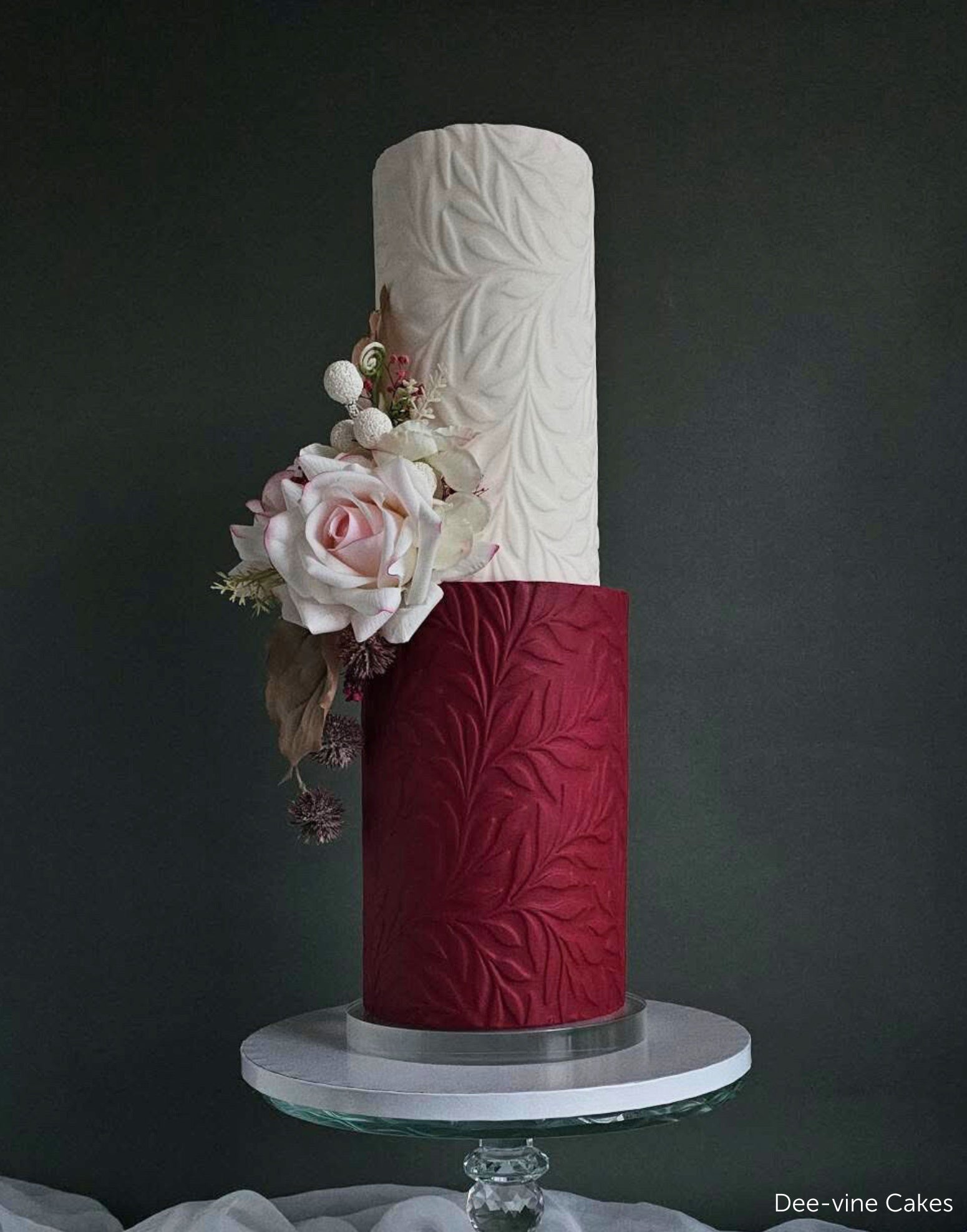 Textured wedding cake covered in a pressed Full Bloom floral pattern by Dee-vine Cakes