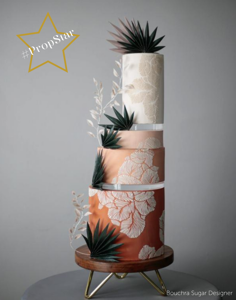 PropStar winning submission - multitiered red cake with c=floral decorations, each tier is separated using 15mm Acrylic Cake Separators - Prop Options