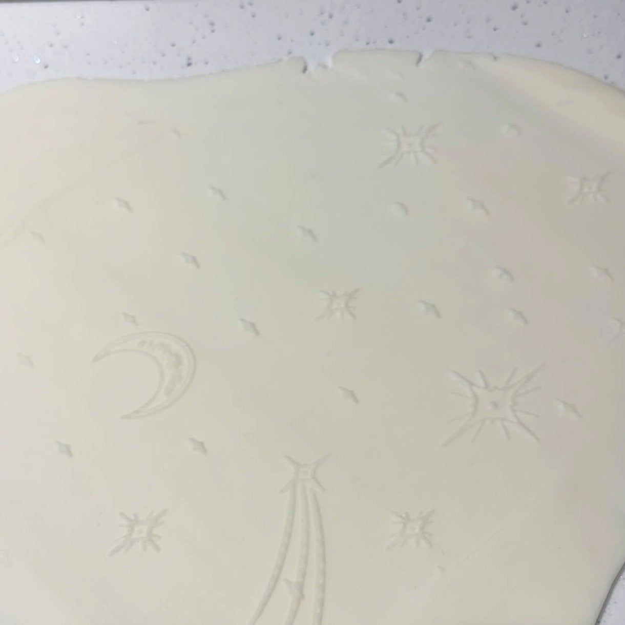Celestial textured rolling pin pattern embossed in fondant