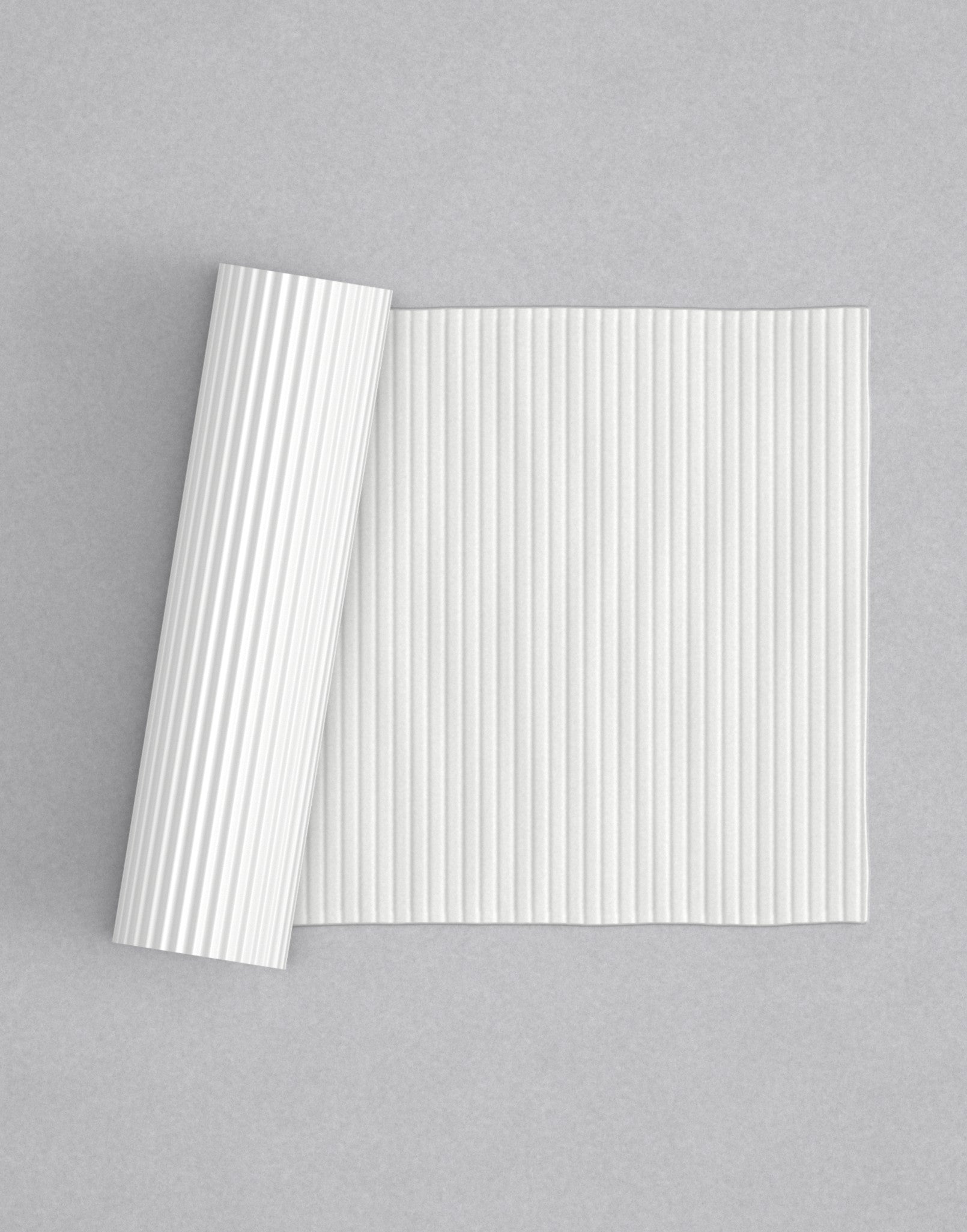 No.11 Reeded mini 4" texture rolling pin with its pattern rolled out on white fondant - Prop Options