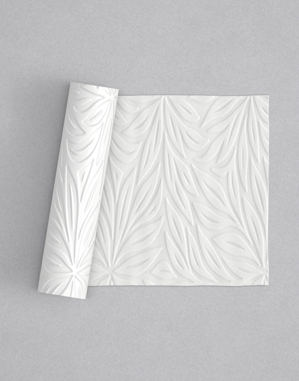 No.20 Full Bloom mini 4" texture rolling pin with its pattern rolled out on white fondant - Prop Options