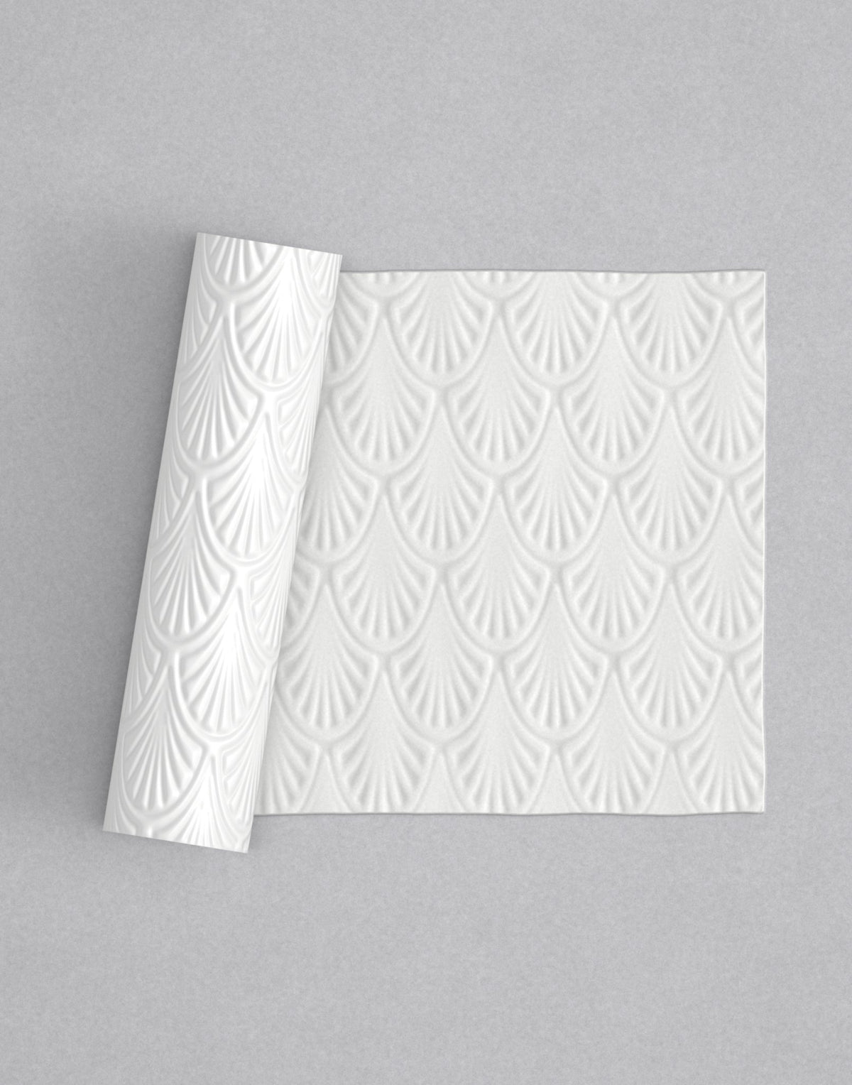 No.44 Art Deco Shell mini 4" texture rolling pin with its pattern rolled out on white fondant - Prop Options