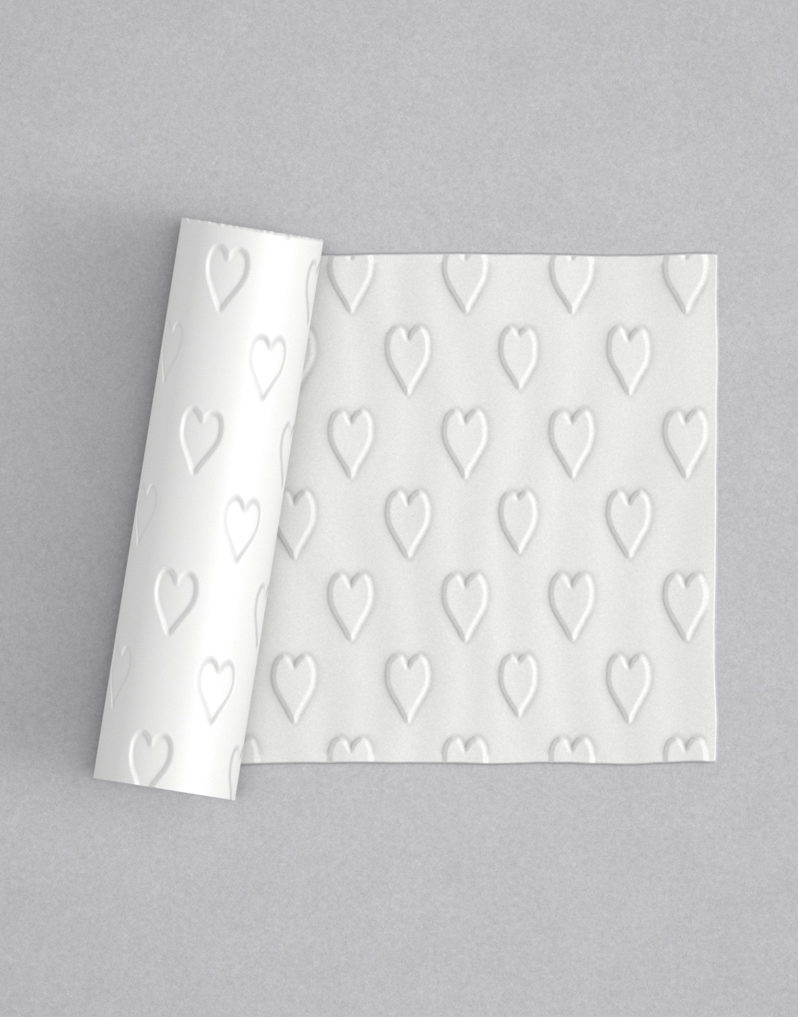 No.73 Hearts mini 4" texture rolling pin with its pattern rolled out on white fondant - Prop Options