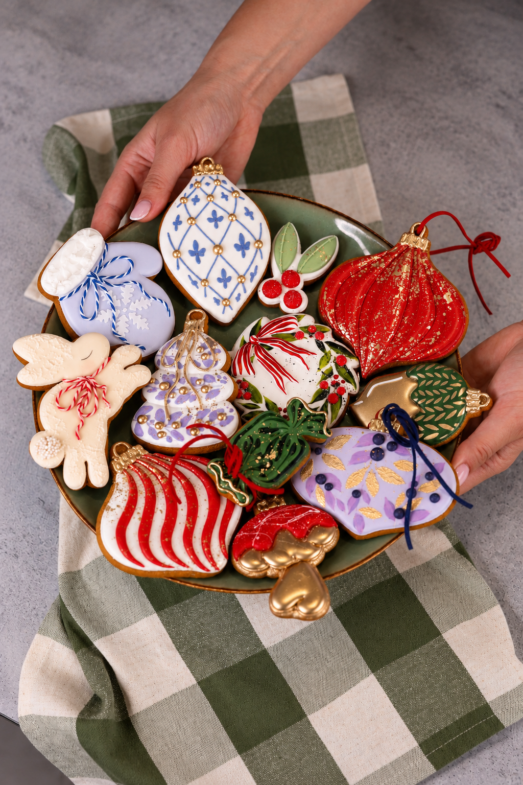 Platter of decorated Christmas cookies held in hand, Prop Options x Ekat's Christmas cookie set