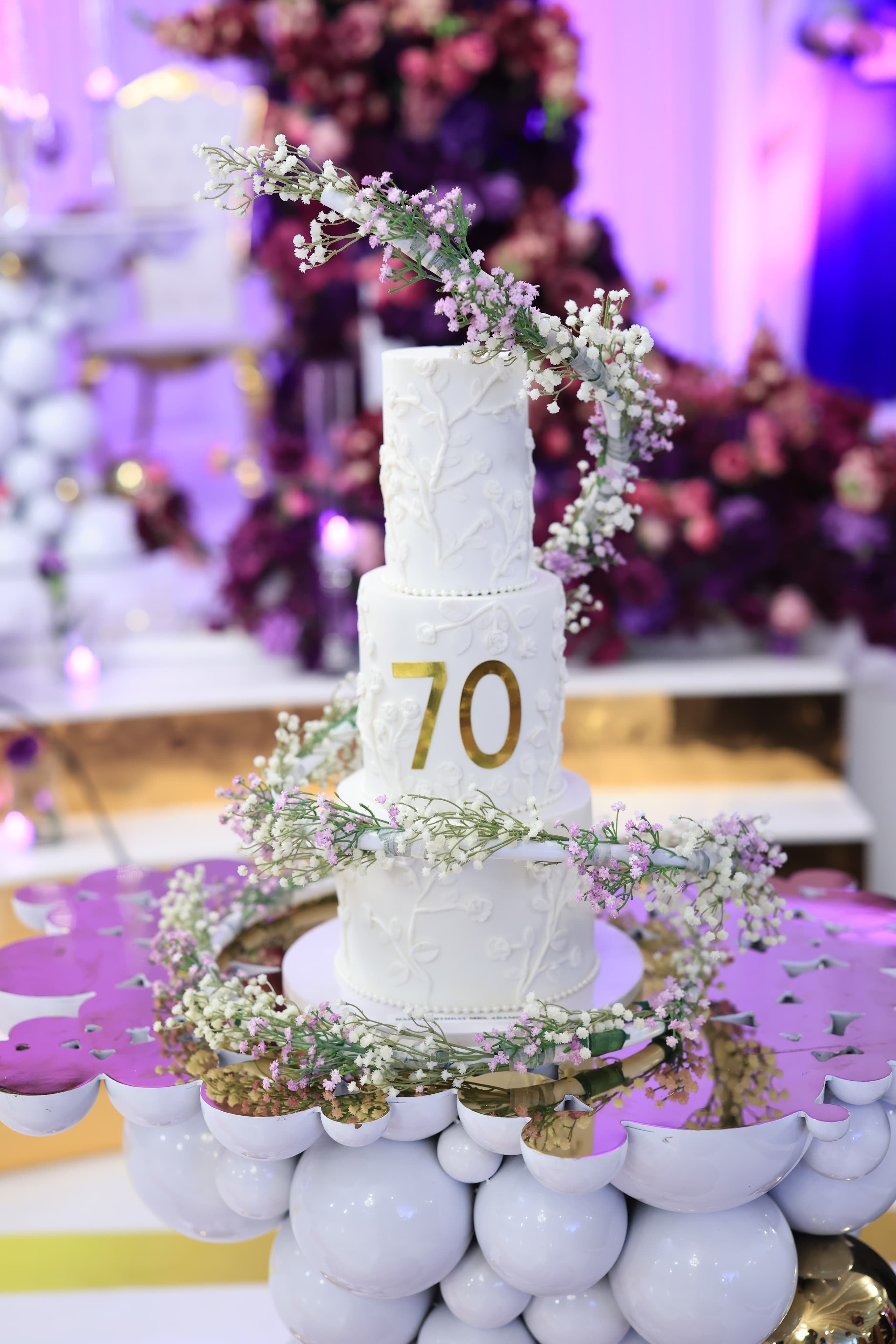 Cake Spiral - Metal Wrap in use on a tall tiered cake, close up of the spiral and floral trim