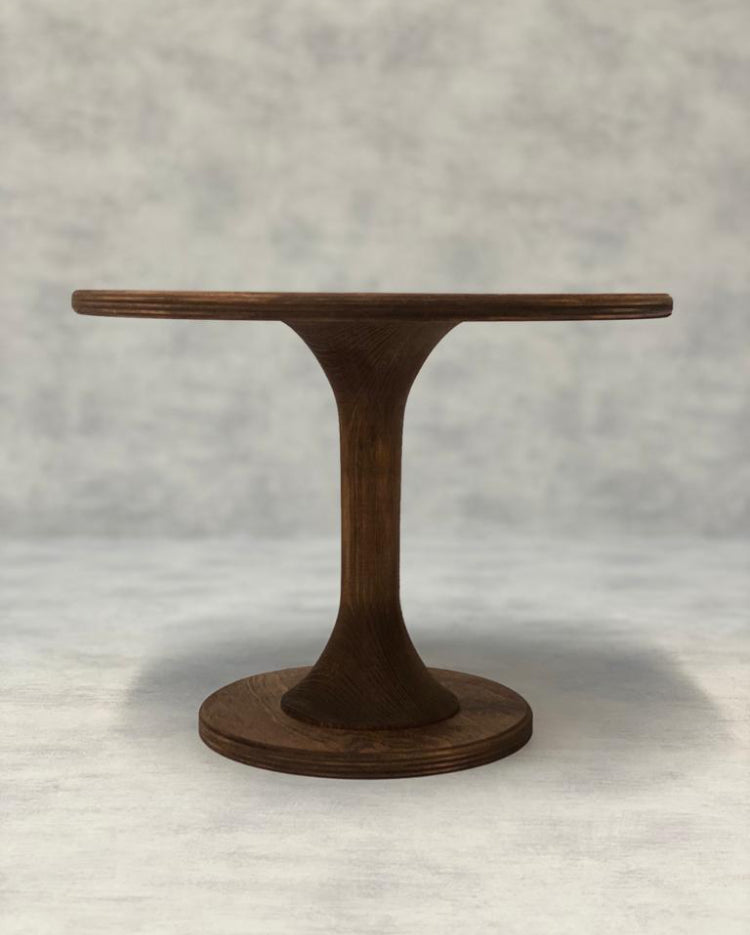The Hourglass Scandinavian Birch Cake Stand tall size in a dark finish - Prop Options