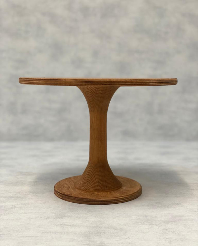 The Hourglass Scandinavian Birch Cake Stand tall size in a light finish - Prop Options