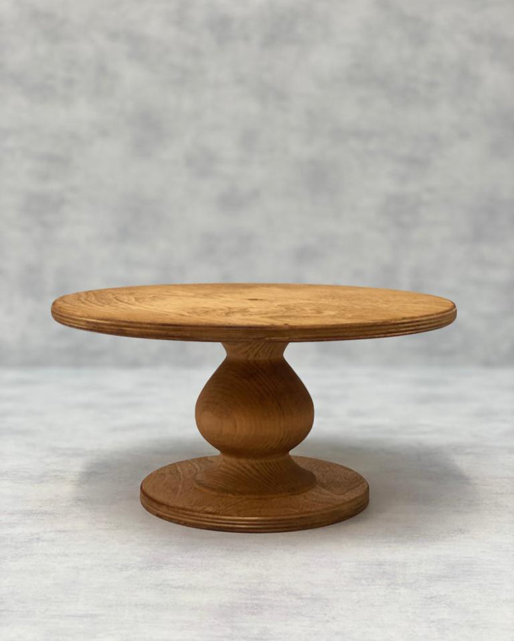The Teardrop Scandinavian Birch Cake Stand in standard size and a light finish - Prop Options