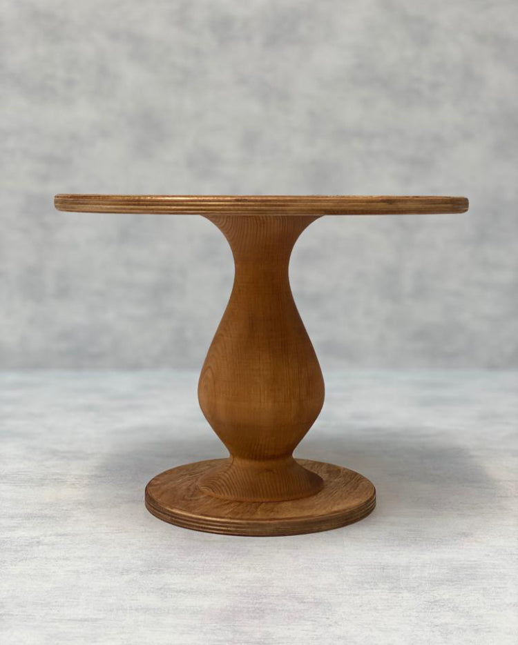 The Teardrop Scandinavian Birch Cake Stand in tall size and a light finish - Prop Options